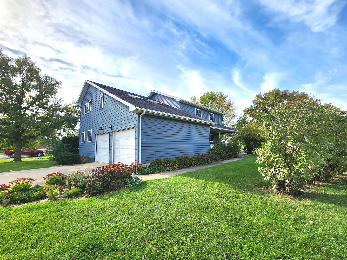 141 Tamarind Court Cabery, IL 60919 - Photo 1 of 37 a backyard of a house with plants and large tree