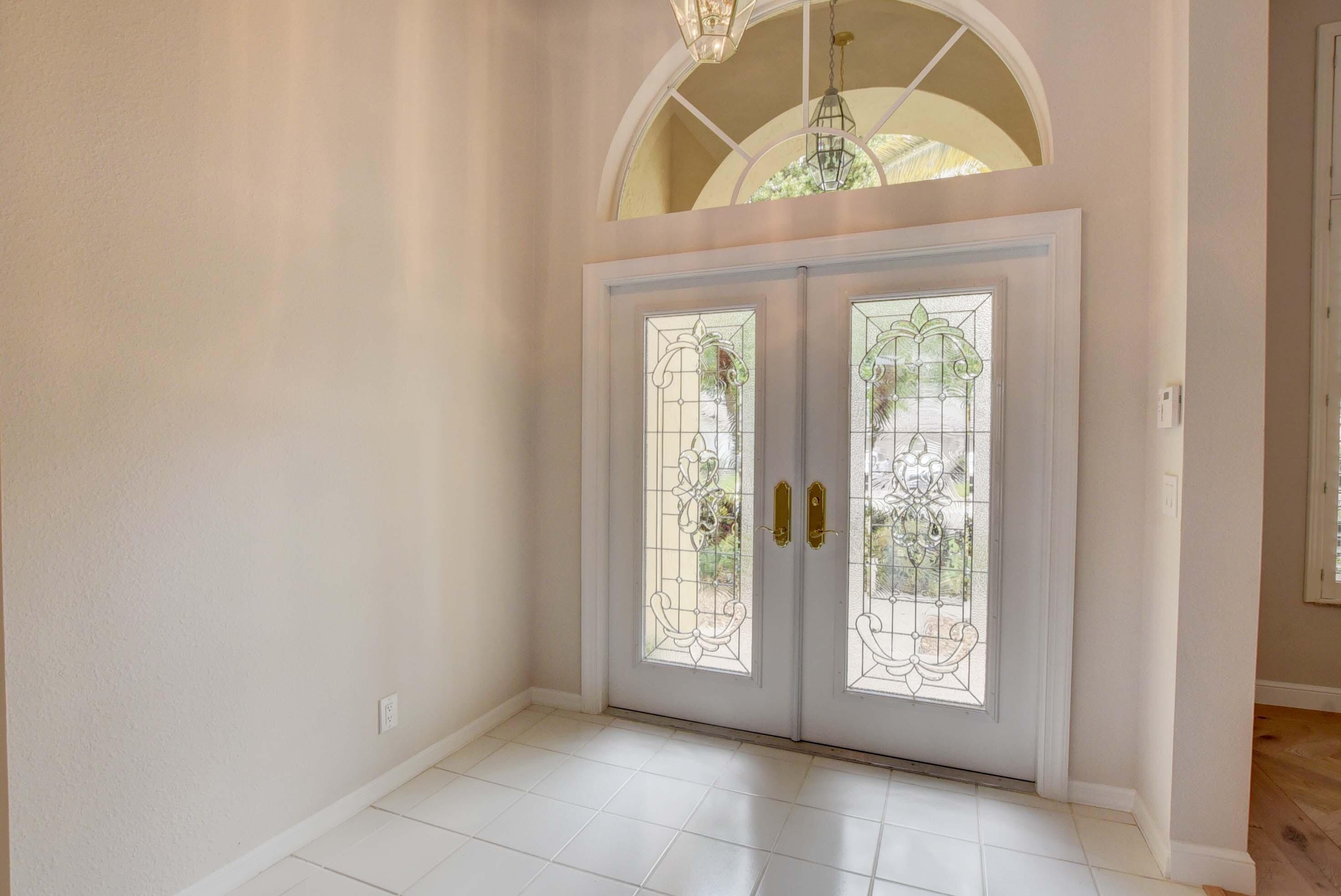 10075 Umberland Place Boca Raton, FL 33428 - Photo 3 of 45 Foyer w/ Lead Glass Front Doors