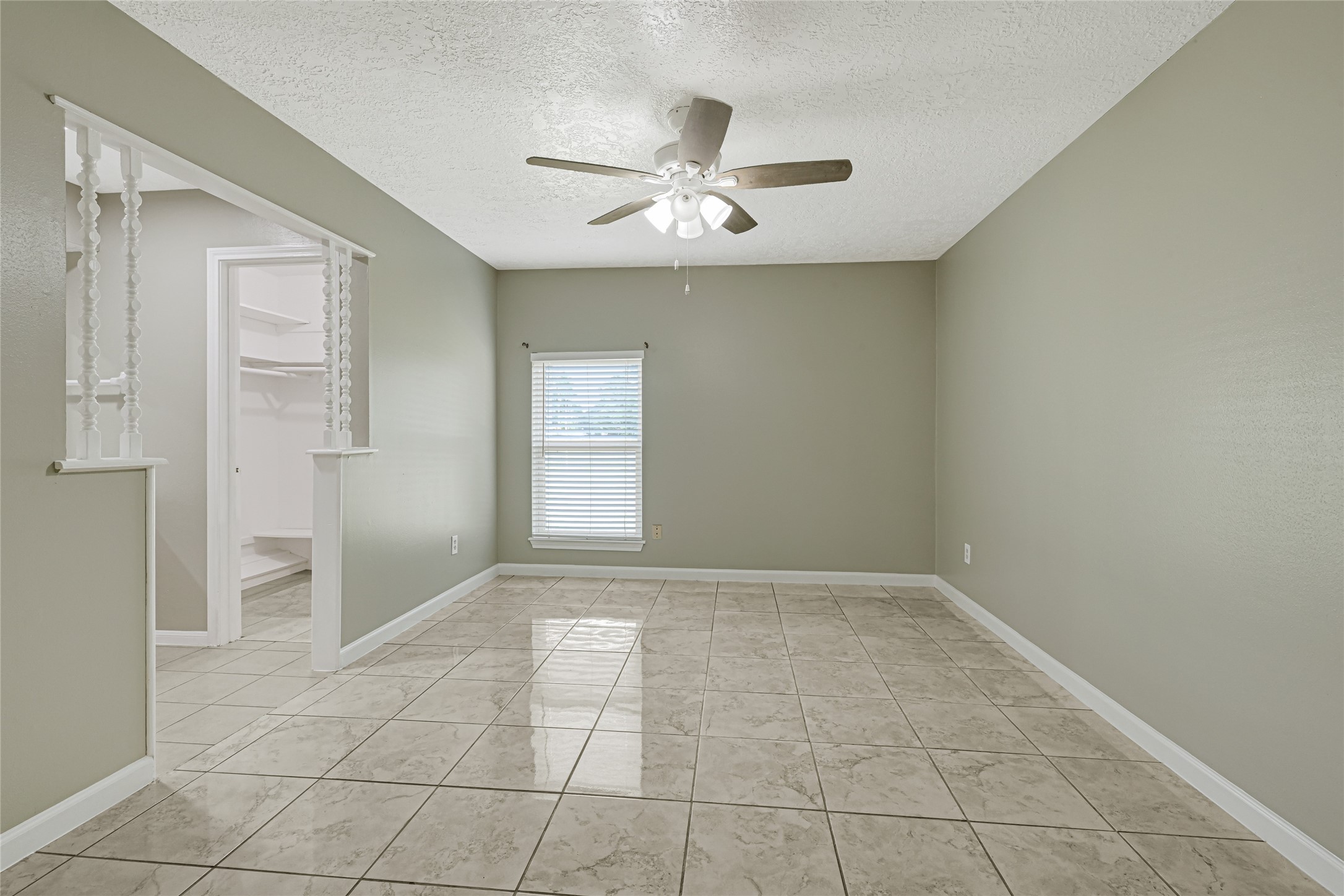 20135 Timber Line Lane New Caney, TX 77357 - Photo 20 of 30 an empty room with windows and fan