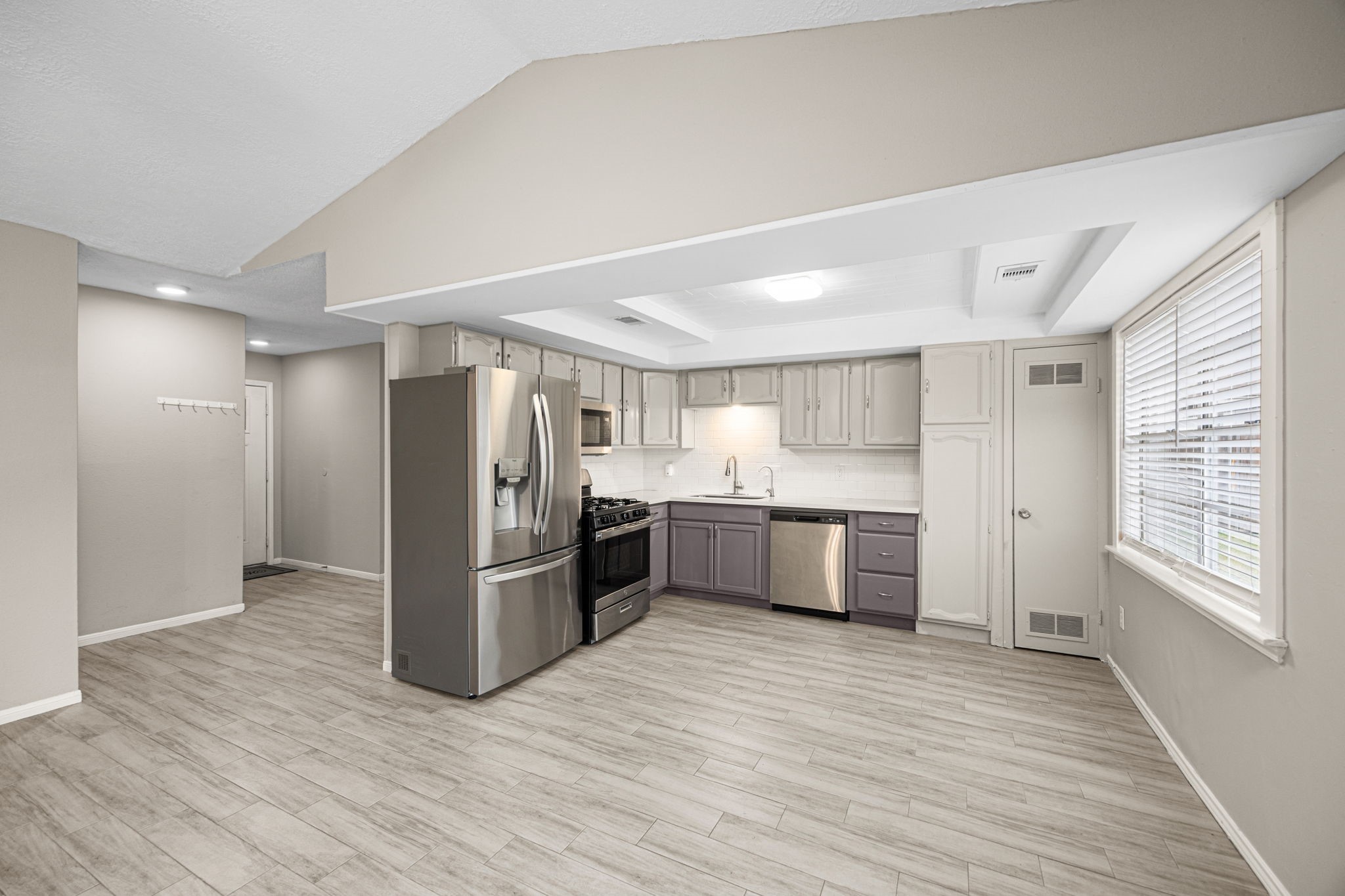 2302 Marble Falls Drive Spring, TX 77373 - Photo 18 of 24 a kitchen with stainless steel appliances a refrigerator and a stove top oven