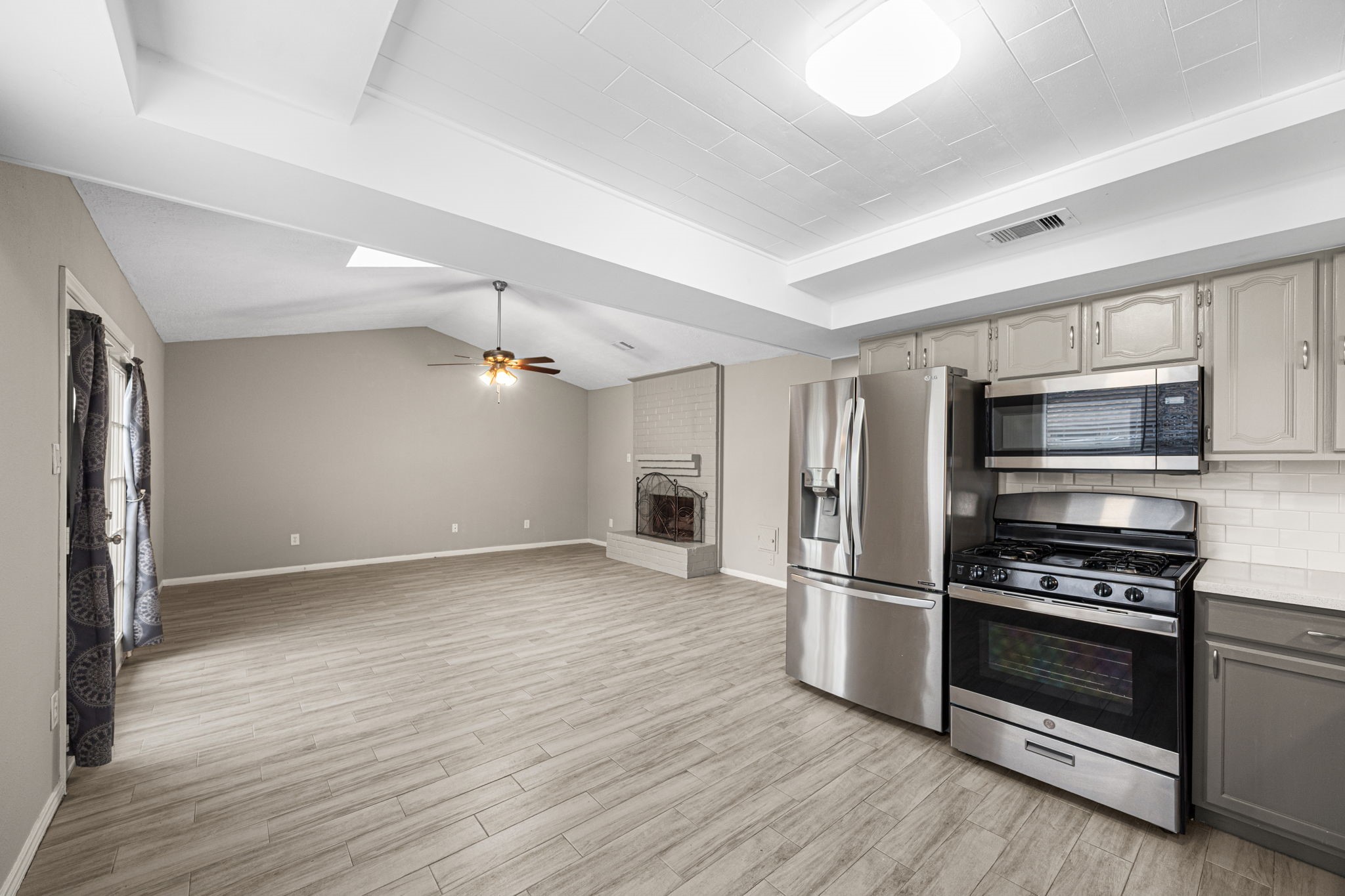 2302 Marble Falls Drive Spring, TX 77373 - Photo 19 of 24 a kitchen with stainless steel appliances a refrigerator and a stove top oven