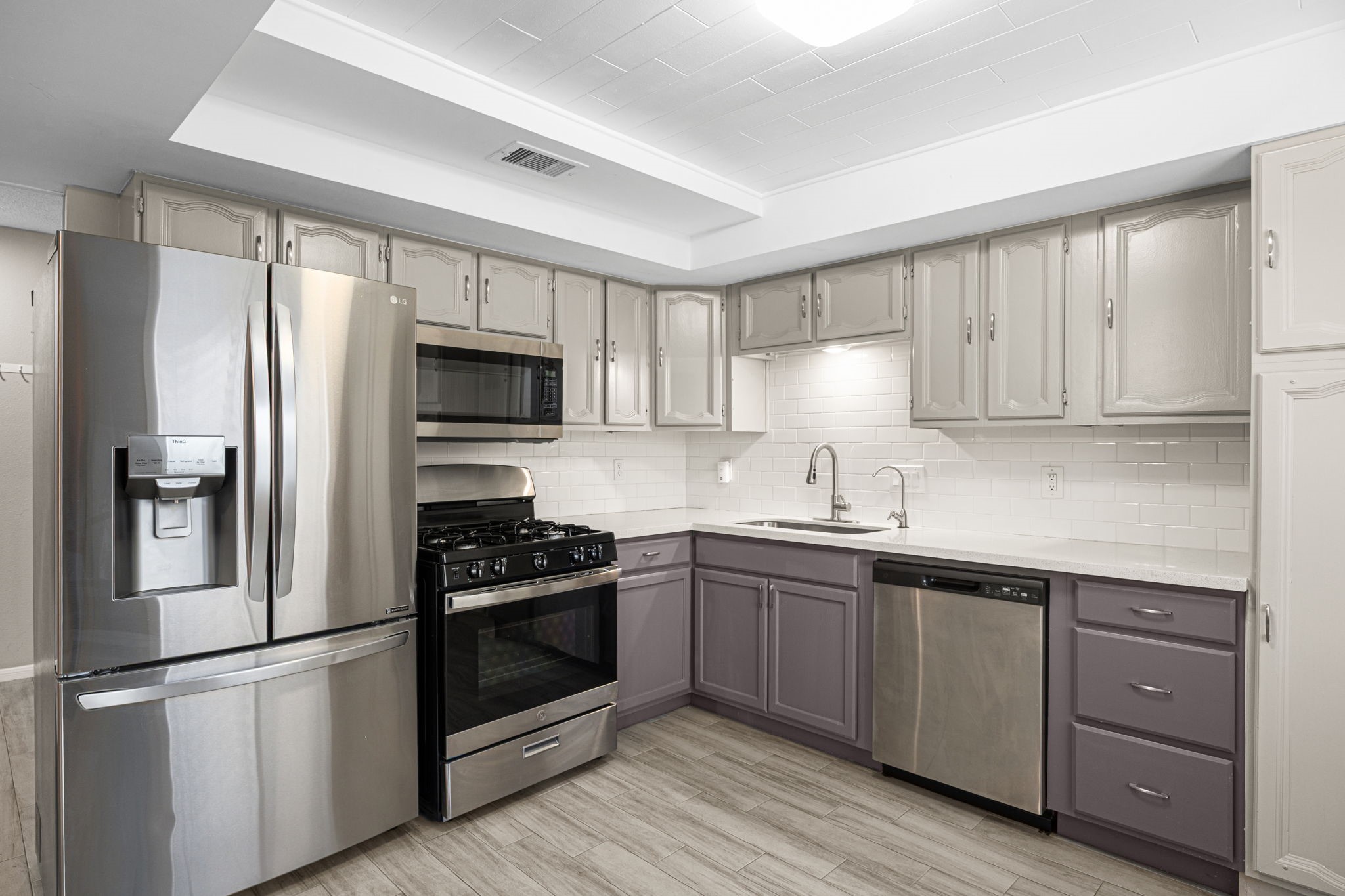 2302 Marble Falls Drive Spring, TX 77373 - Photo 20 of 24 a kitchen with a sink stainless steel appliances and cabinets