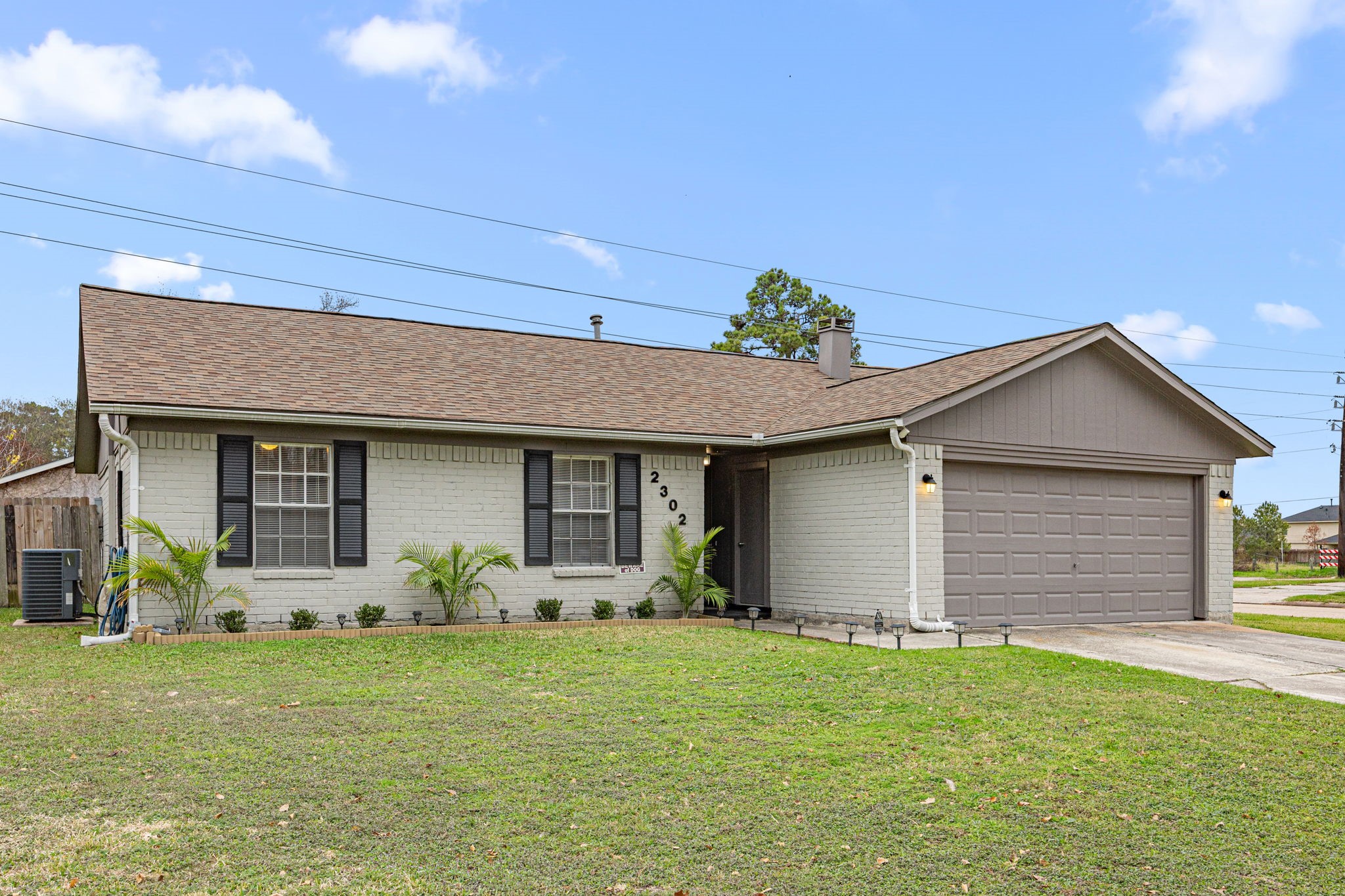 2302 Marble Falls Drive Spring, TX 77373 - Photo 2 of 24 a front view of a house with garden