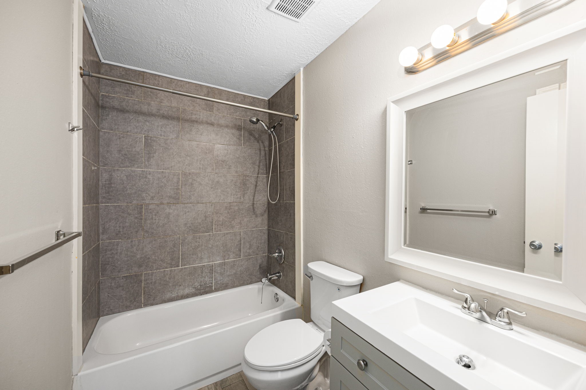 2302 Marble Falls Drive Spring, TX 77373 - Photo 9 of 24 a bathroom with a bathtub shower sink vanity mirror and toilet