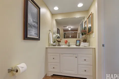 a bathroom with a mirror and sink