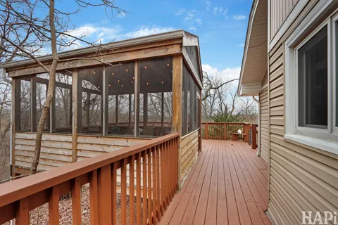 a view of balcony with wooden floor
