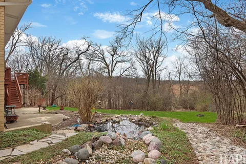 a backyard of a house with lots of green space