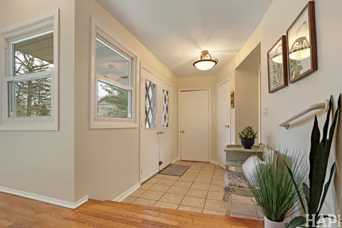 a view of entryway with wooden floor