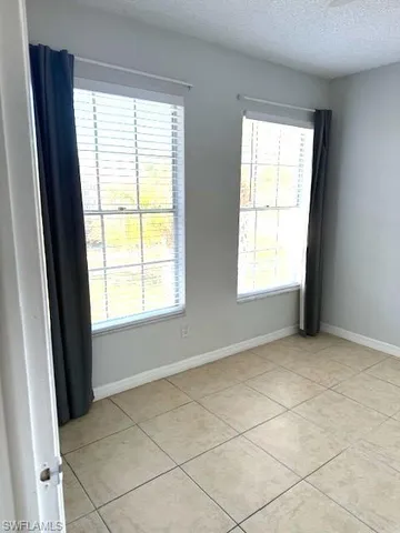 a kitchen with a stove a refrigerator and a sink
