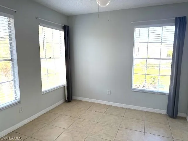 a close view of a stove top oven and refrigerator