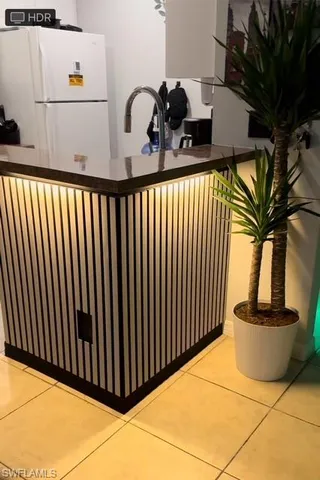 a bathroom with a granite countertop toilet sink and mirror