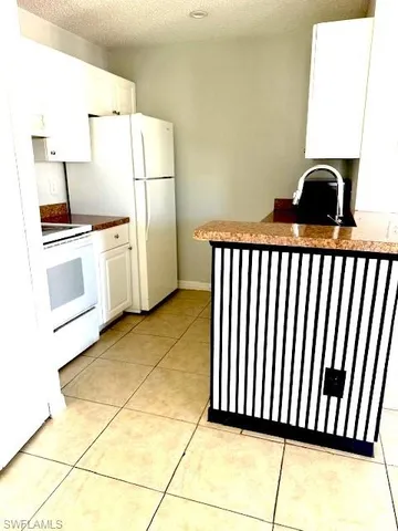 a view of a park with swings and slides