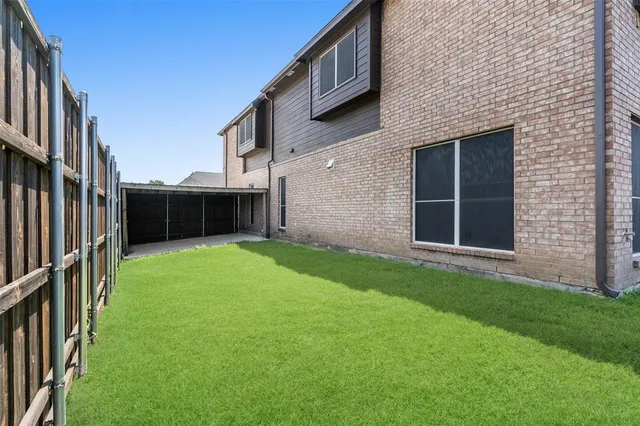 a backyard of a house with lots of green space