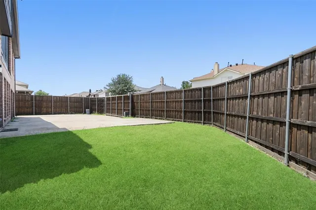 a view of a backyard with a garden and stairs