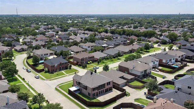 an aerial view of house with yard
