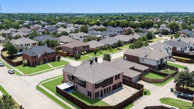 an aerial view of a house with swimming pool garden and mountain view