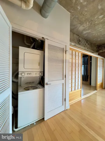 a kitchen with a refrigerator and microwave