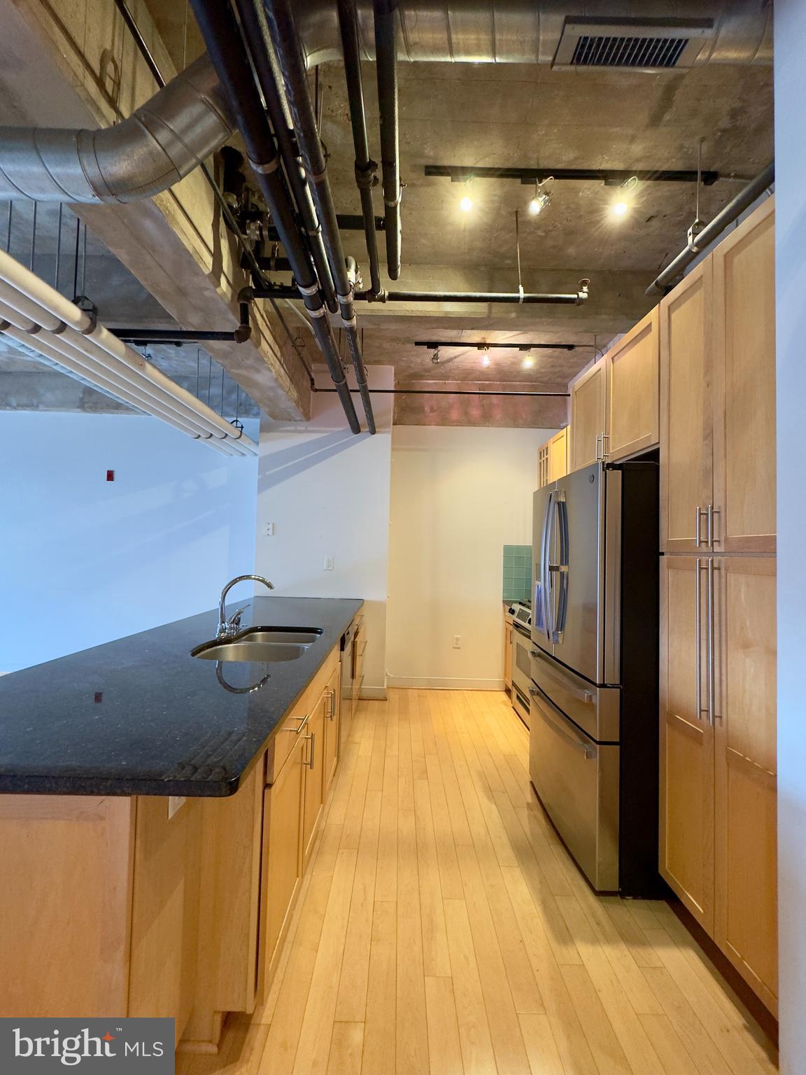 234 Holliday Street, Unit 403 Baltimore, MD 21202 - Photo 4 of 11 a view of a room with wooden floor