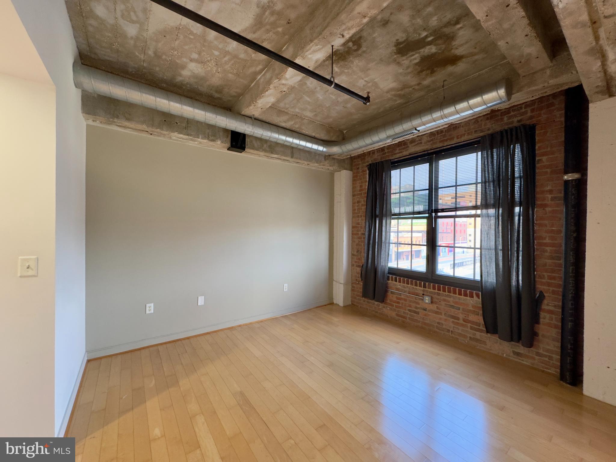 234 Holliday Street, Unit 403 Baltimore, MD 21202 - Photo 7 of 11 a view of an empty room with a window