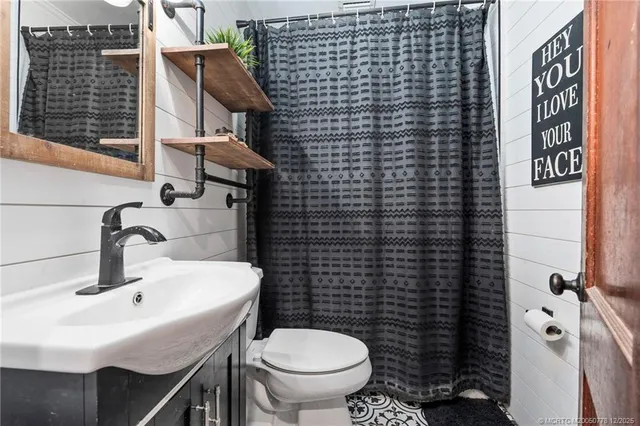 a view of balcony with wooden floor and fence