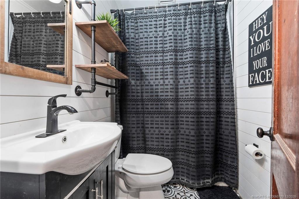 1699 Northwest Britt Road Stuart, FL 34994 - Photo 15 of 54 a bathroom with a sink and a toilet