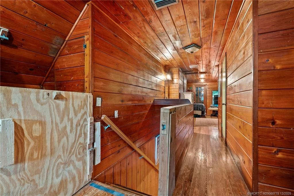 1699 Northwest Britt Road Stuart, FL 34994 - Photo 18 of 54 a view of balcony with wooden floor and fence