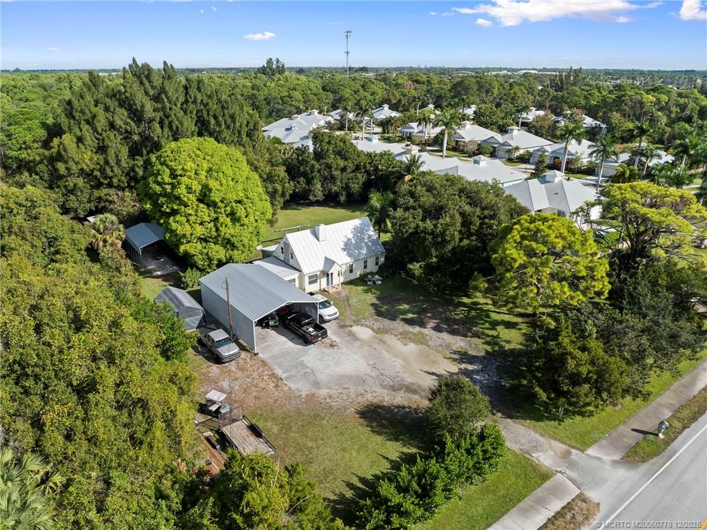 1699 Northwest Britt Road Stuart, FL 34994 - Photo 30 of 54 an aerial view of a house with a yard