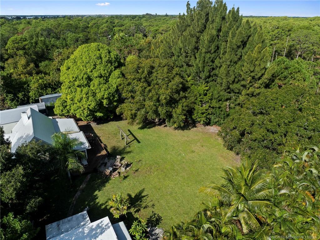 1699 Northwest Britt Road Stuart, FL 34994 - Photo 34 of 54 an aerial view of a house with a yard