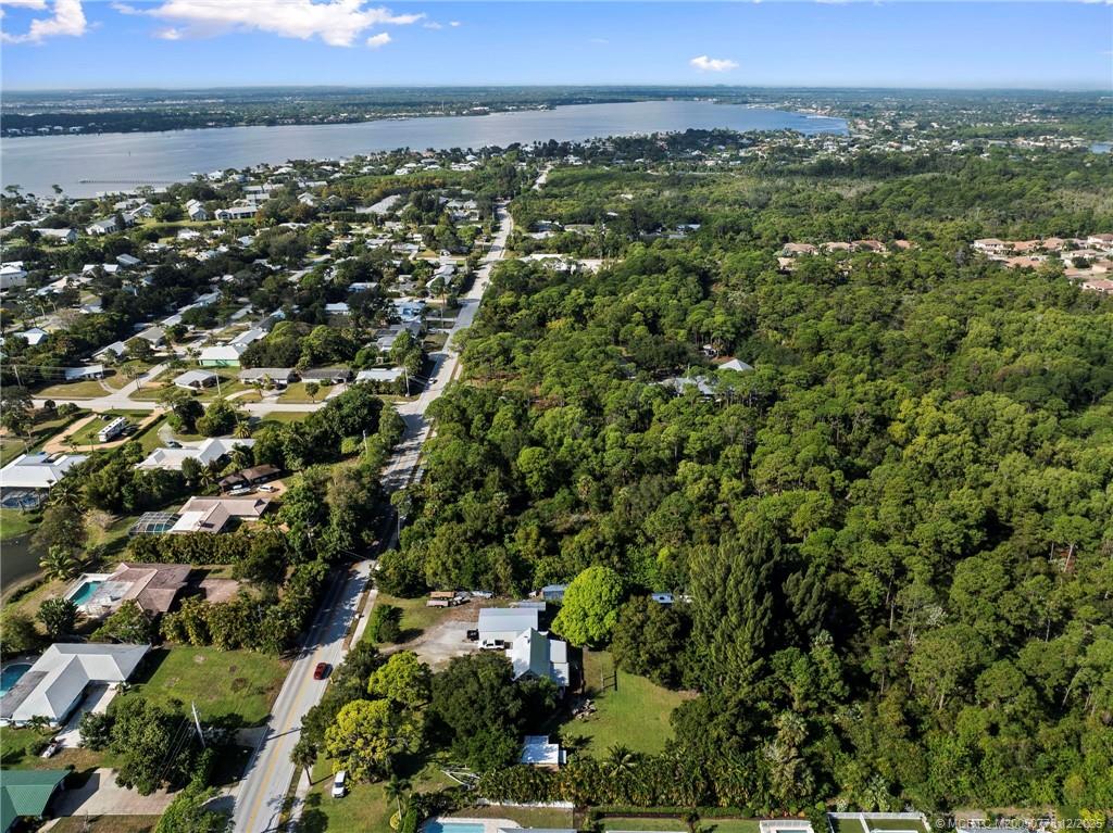 1699 Northwest Britt Road Stuart, FL 34994 - Photo 35 of 54 an aerial view of a city with lots of residential buildings