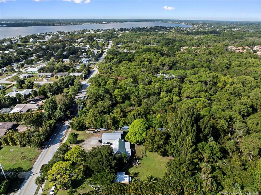 1699 Northwest Britt Road Stuart, FL 34994 - Photo 36 of 54 a view of a city with lush green forest