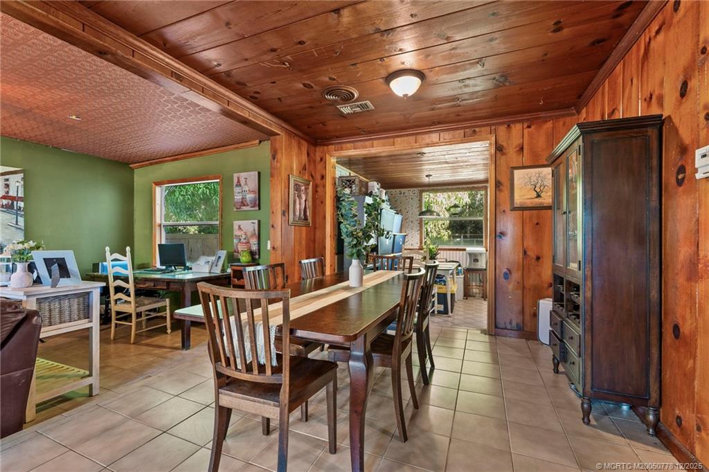 1699 Northwest Britt Road Stuart, FL 34994 - Photo 4 of 54 a view of a dining room with furniture window and outside view