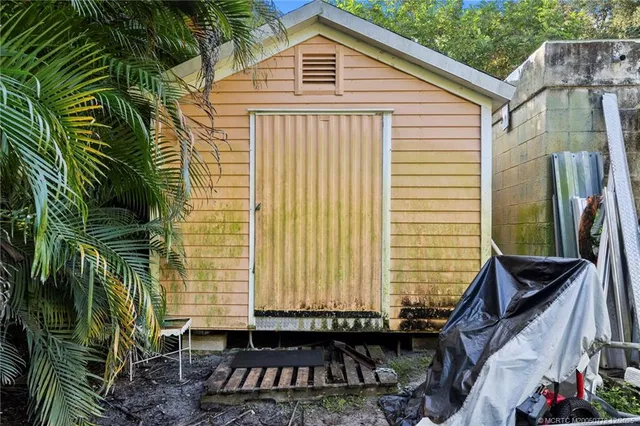 a backyard of a house with barbeque oven