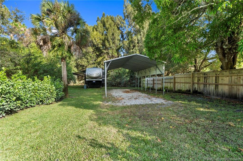 1699 Northwest Britt Road Stuart, FL 34994 - Photo 51 of 54 a backyard of a house with barbeque oven