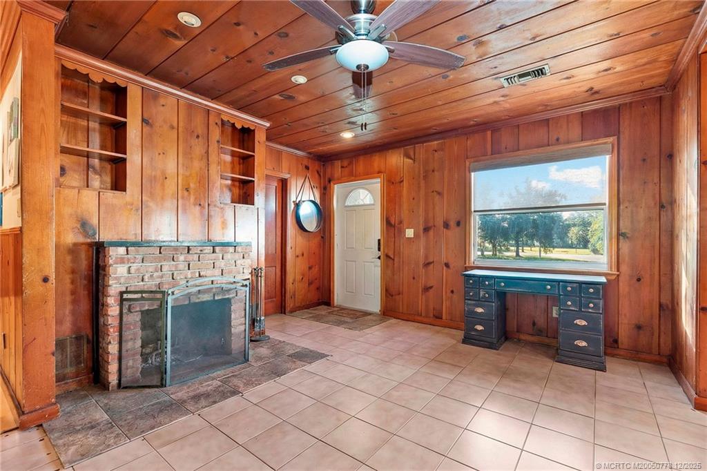 1699 Northwest Britt Road Stuart, FL 34994 - Photo 7 of 54 an empty room with windows & cabinet