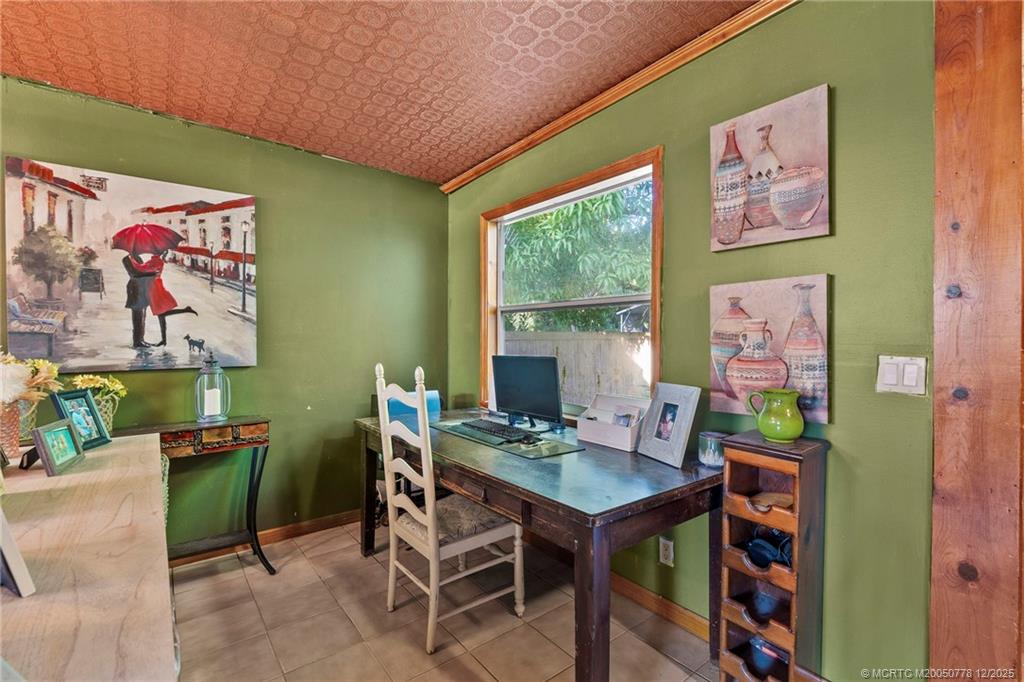 1699 Northwest Britt Road Stuart, FL 34994 - Photo 10 of 54 a workspace with furniture and window