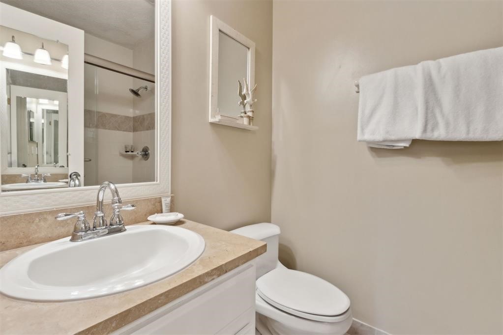 2004 Beachwood Road, Unit 2004 Fernandina Beach, FL 32034 - Photo 31 of 54 a bathroom with a granite countertop sink and a mirror