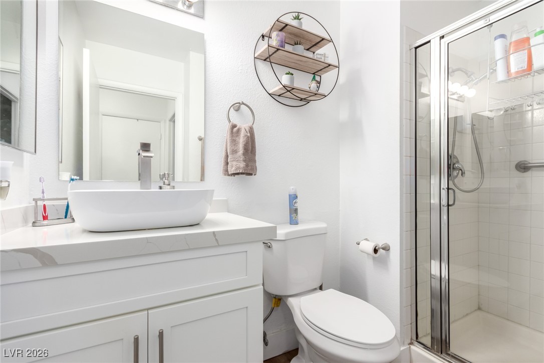 906 Ambusher Street Henderson, NV 89014 - Photo 25 of 38 Full bathroom with a shower stall and vanity