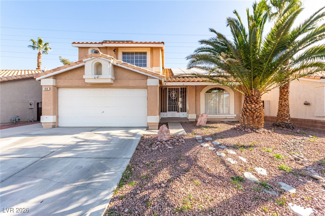 906 Ambusher Street Henderson, NV 89014 - Photo 32 of 38 Mediterranean / spanish house with roof mounted solar panels, stucco siding, concrete driveway, and a tile roof