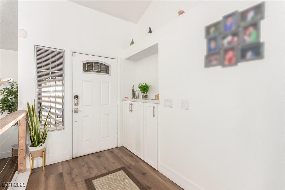 906 Ambusher Street Henderson, NV 89014 - Photo 5 of 38 Foyer with dark wood-type flooring and a heating unit