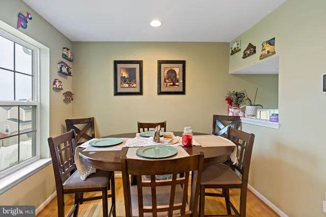 a view of a dining room that has a table and chairs