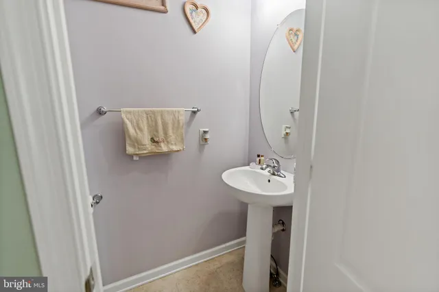 a bathroom with a sink and mirror