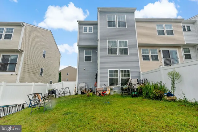 a front view of house with yard and outdoor seating