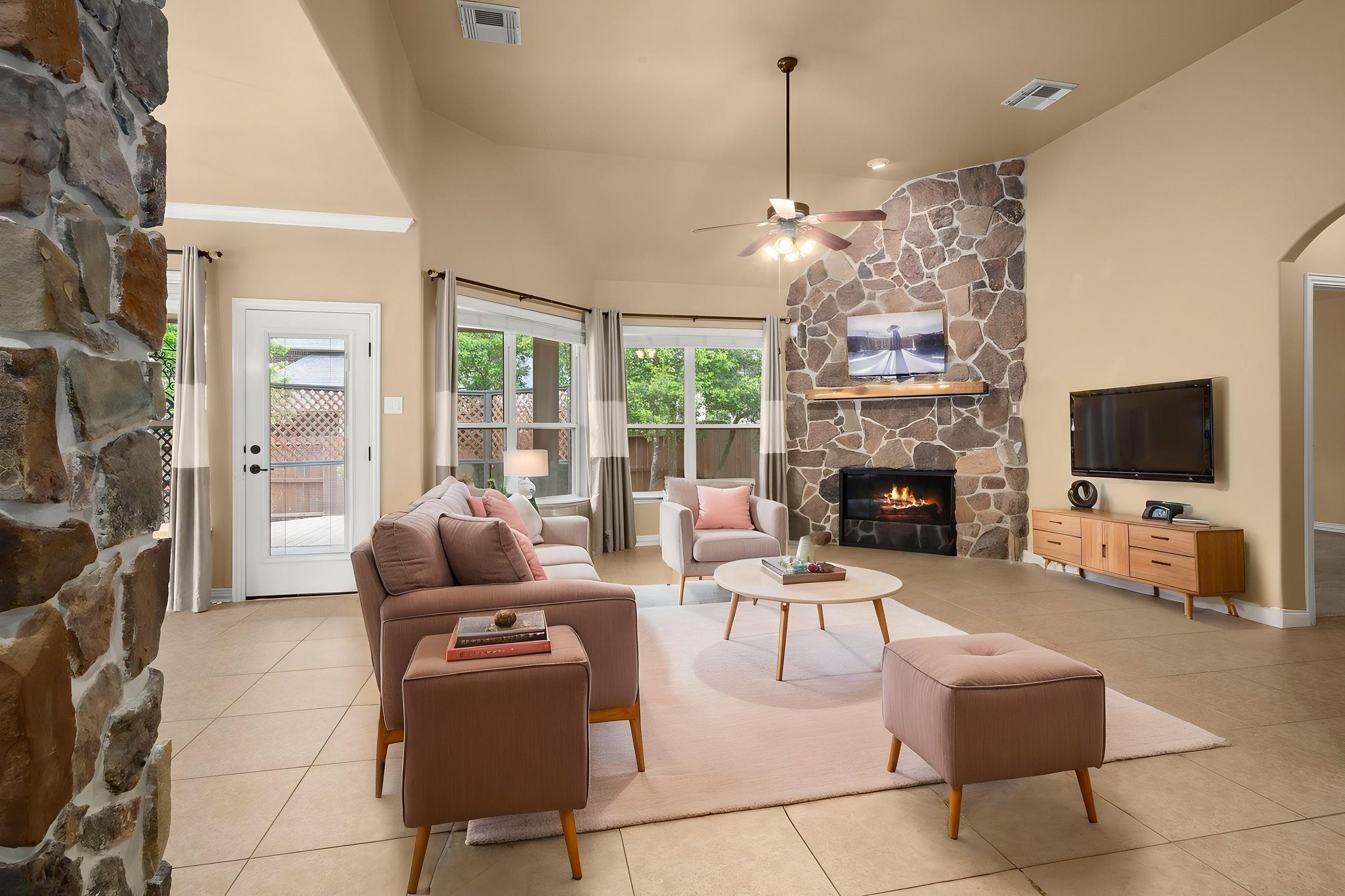 110 David Forest Lane Conroe, TX 77384 - Photo 20 of 35 a living room with furniture a flat screen tv and a fireplace