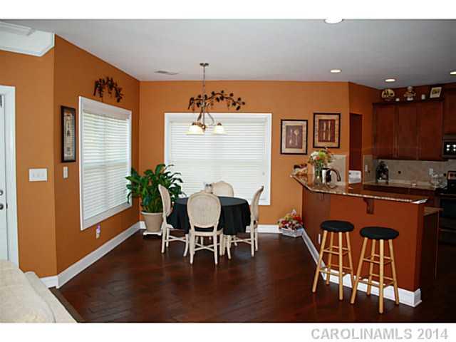 1032 Ridgehaven Road Waxhaw, NC 28173 - Photo 6 of 16 a dining room with furniture and wooden floor