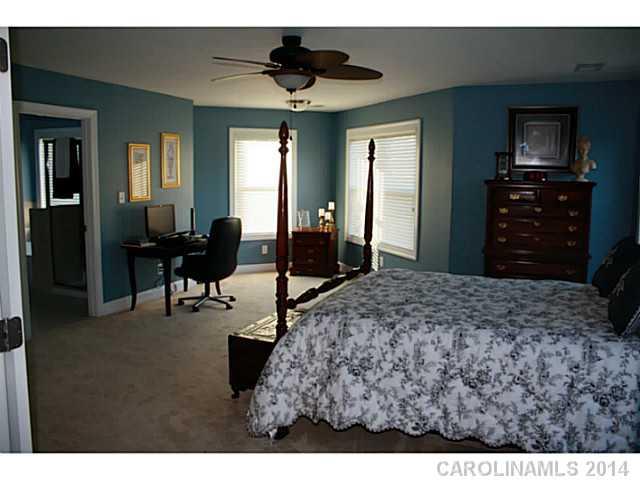 1032 Ridgehaven Road Waxhaw, NC 28173 - Photo 8 of 16 a living room with furniture and a flat screen tv
