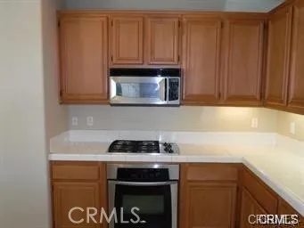 a kitchen with a sink cabinets and utility