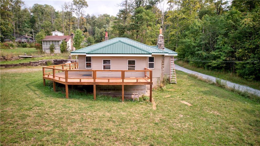 1276 Glades Pike Somerset, PA 15501 - Photo 1 of 32 a front view of a house with a yard table and chairs
