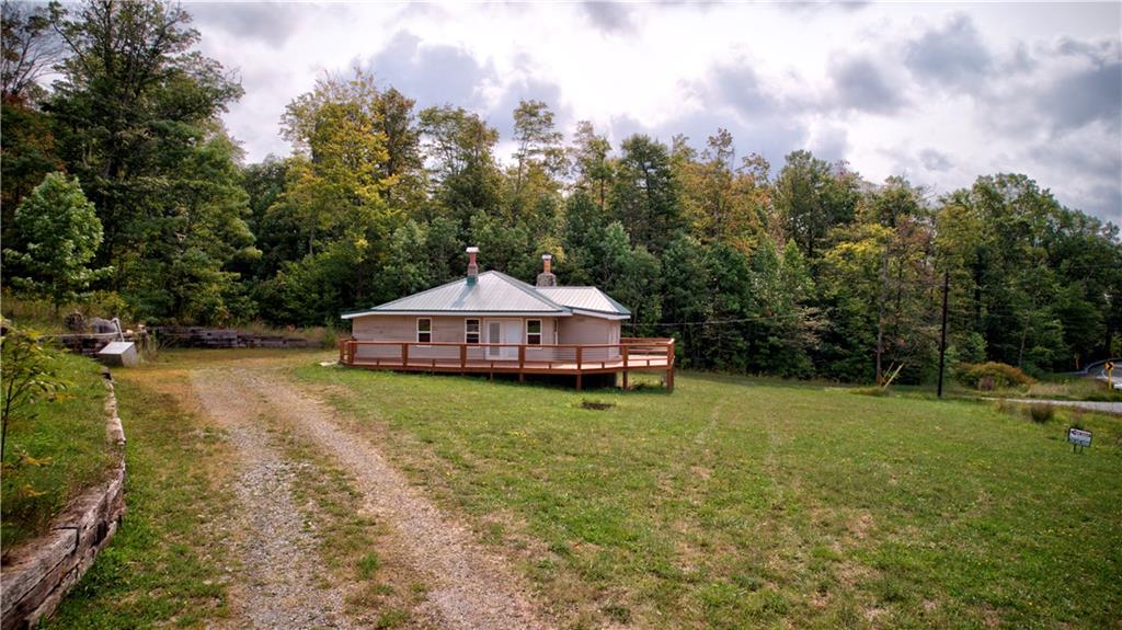 1276 Glades Pike Somerset, PA 15501 - Photo 11 of 32 a view of a house with a yard and roof