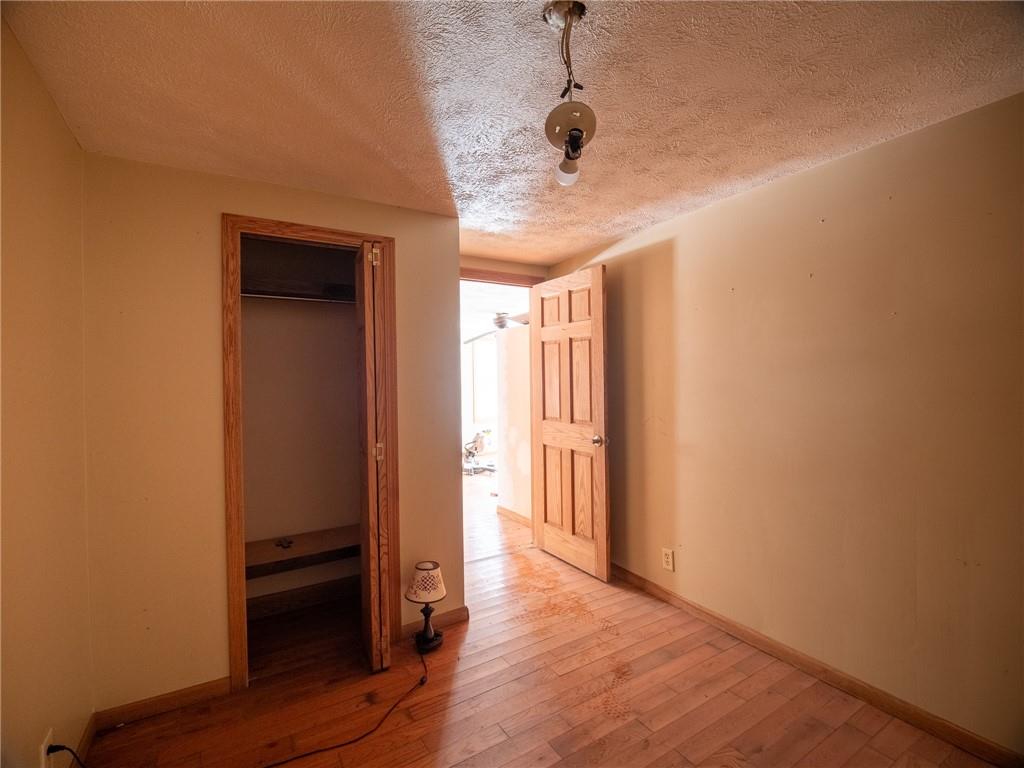 1276 Glades Pike Somerset, PA 15501 - Photo 24 of 32 a view of a hallway with wooden floor and closet