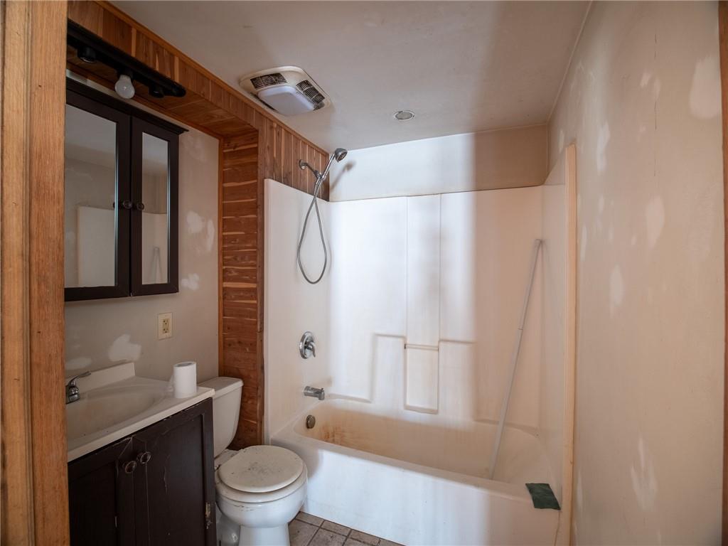 1276 Glades Pike Somerset, PA 15501 - Photo 26 of 32 a bathroom with a granite countertop sink toilet and shower